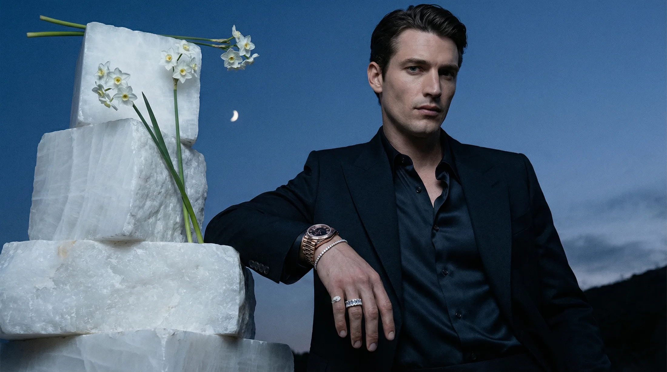 Male model wearing a luxury watch with jewellery